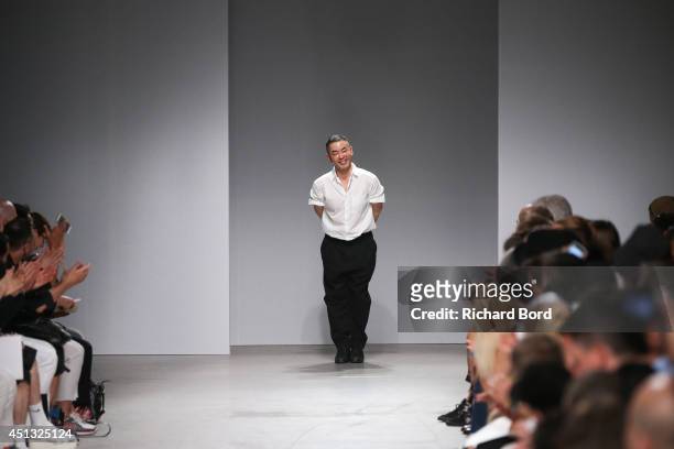 Designer Juun J walks the runway after the Juun J show as part of the Paris Fashion Week Menswear Spring/Summer 2015 at Palais de Tokyo on June 27,...