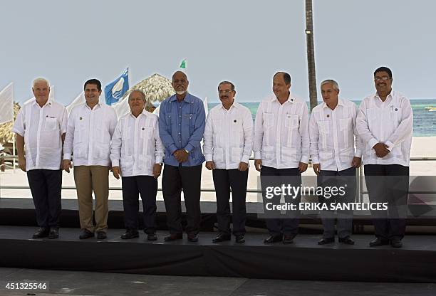 Leaders gathering for the SICA Summit, pose for the official picture in Puna Cana, in the Dominican Republic, on June 27, 2014. Panama's President...