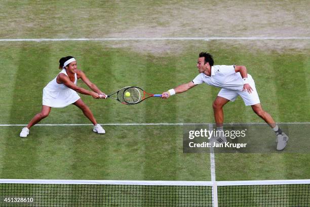 Ross Hutchins and Heather Watson of Great Britain during their Mixed Doubles first round match against Mikhail Elgin of Russia and Anastasia...