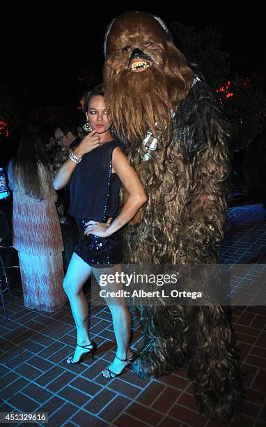 Actress Crystal Allen poses with Chewbacca at the After Party for the 40th Annual Saturn Awards held at on June 26, 2014 in Burbank, California.