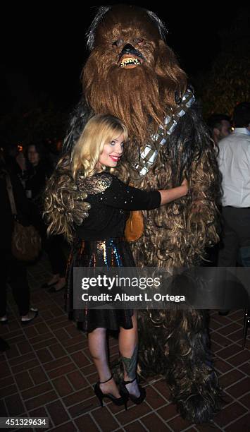 Actress Emma Julia Jacobs poses with Chewbacca at the After Party for the 40th Annual Saturn Awards held at on June 26, 2014 in Burbank, California.