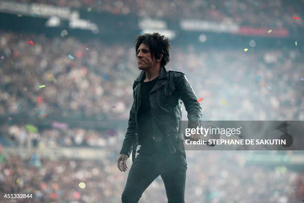 French singer Nicolas Sirkis from Indochine band performs on June 27, 2014 at the Stade de France, in Saint-Denis, north of Paris. AFP PHOTO /...