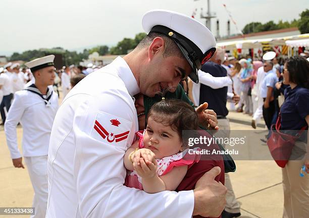 Members of the Turkish Maritime Task Group Barbaros are welcomed upon their arrival at Golcuk Naval Base in Kocaeli, Turkey on June 27, 2014. Turkish...