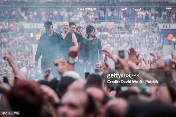 Nicola Sirkis, Marco, Boris Jardel, Oli de Sat and Mr Shoes from Indochine performs at Stade de France on June 27, 2014 in Paris, France.
