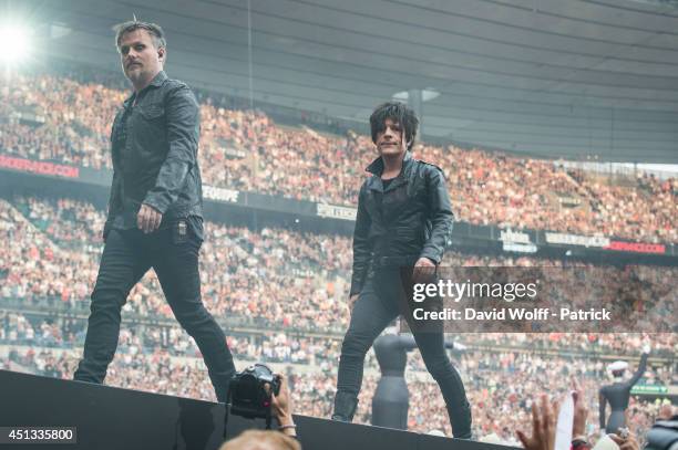 Nicola Sirkis and Oli de Sat from Indochine performs at Stade de France on June 27, 2014 in Paris, France.