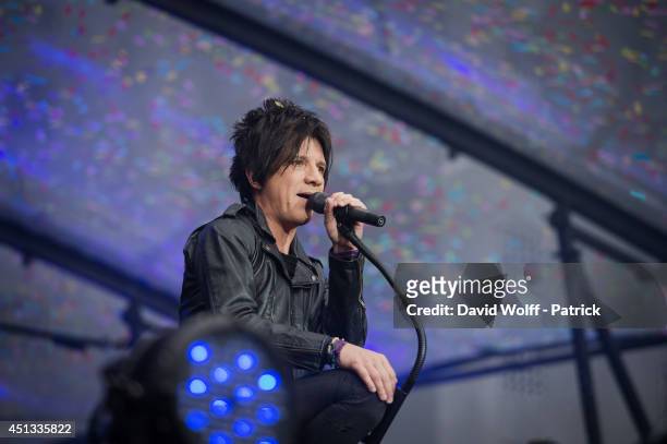 Nicola Sirkis from Indochine performs at Stade de France on June 27, 2014 in Paris, France.