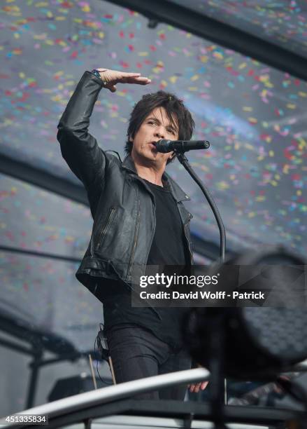 Nicola Sirkis from Indochine performs at Stade de France on June 27, 2014 in Paris, France.