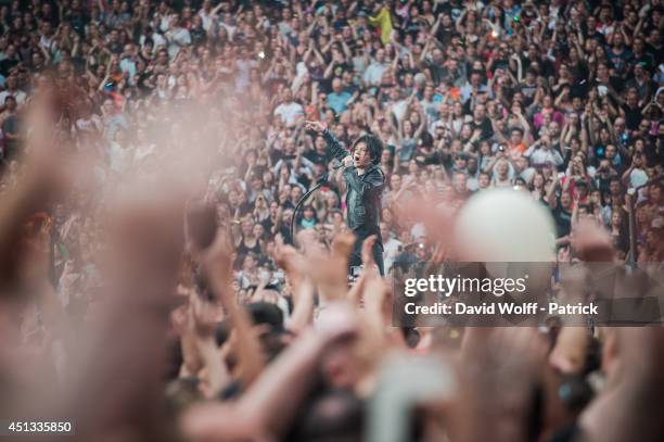 Nicola Sirkis from Indochine performs at Stade de France on June 27, 2014 in Paris, France.