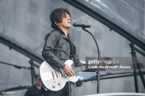 Nicola Sirkis from Indochine performs at Stade de France on June 27, 2014 in Paris, France.