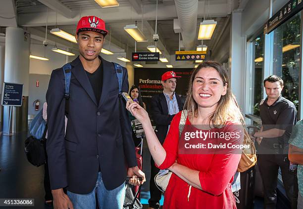 Brazilian Basketball player Bruno Caboclo drafted 20th over all by the Raptors arrives on Porter Airlines from Newark NJ at Billy Bishop Airport in...