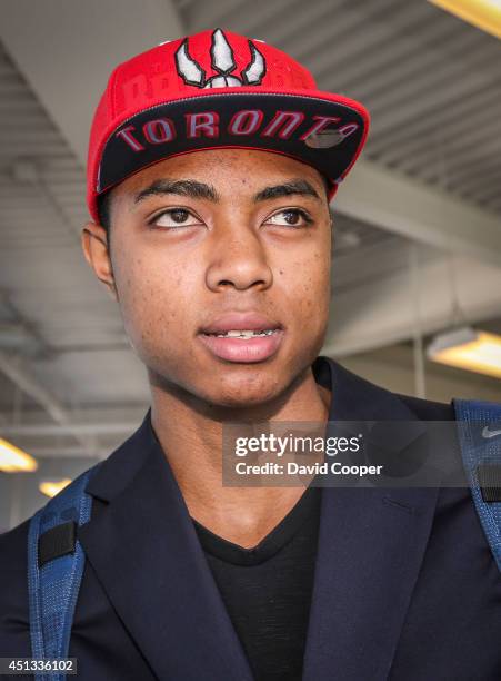 Brazilian Basketball player Bruno Caboclo drafted 20th over all by the Raptors arrives on Porter Airlines from Newark NJ at Billy Bishop Airport in...