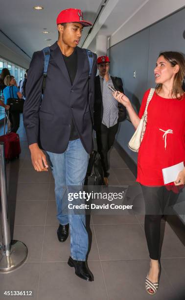 Brazilian Basketball player Bruno Caboclo drafted 20th over all by the Raptors arrives on Porter Airlines from Newark NJ at Billy Bishop Airport in...