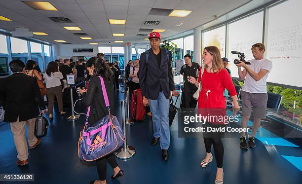 Brazilian Basketball player Bruno Caboclo drafted 20th over all by the Raptors arrives on Porter Airlines from Newark NJ at Billy Bishop Airport in...