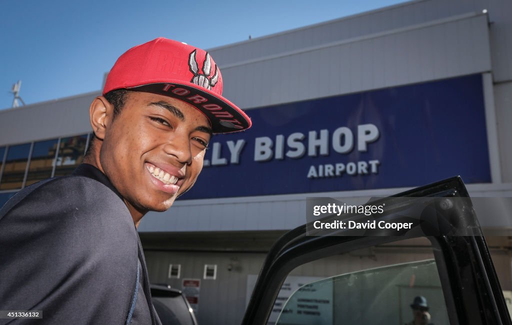 Brazilian Basketball player Bruno Caboclo drafted 20th over all by the Raptors arrives on Porter Airlines from Newark NJ at Billy Bishop Airport in Toronto. Toronto Star reporter Isabel Teotonio (in Red) talks to Bruno as he arrived.
