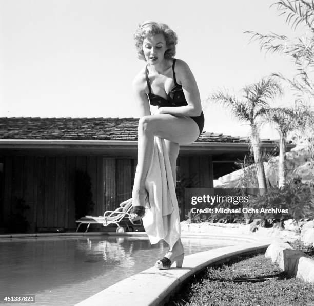 Actress Rhonda Fleming pose at home in Los Angeles, California.