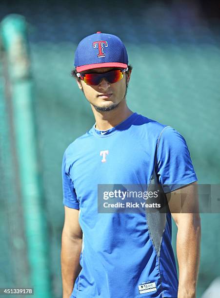 Yu Darvish of the Texas Rangers observes the field during batting practice before the game against the Minnesota Twins at Globe Life Park in...