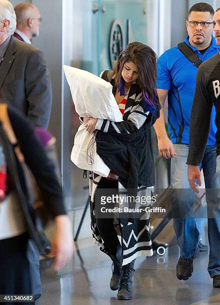 Selena Gomez is seen at Los Angeles International Airport on January 21, 2012 in Los Angeles, California.