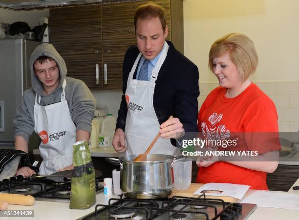 Britain's Prince William, Duke of Cambridge helps with a cookery lesson at the Centrepoint support centre in Sunderland, north-east England, on...