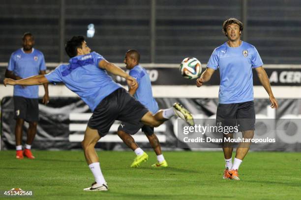 Diego Lugano in action during the first Uruguay training session since team mate Luis Suarez was suspended by FIFA at the 2014 FIFA World Cup held at...