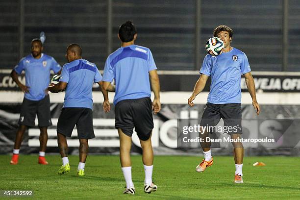 Diego Lugano in action during the first Uruguay training session since team mate Luis Suarez was suspended by FIFA at the 2014 FIFA World Cup held at...