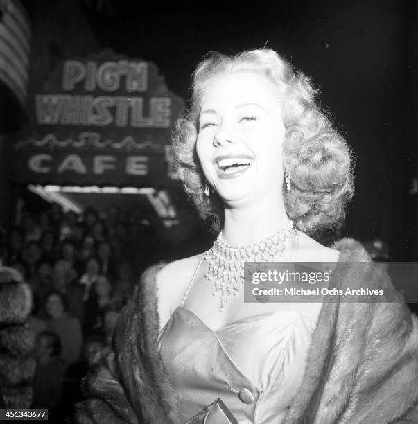 Actress Mitzi Gaynor attends a party at the Pig'n Whistle in Los Angeles, California.