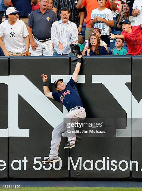 Brock Holt of the Boston Red Sox makes a catch on a ball hit in the second inning by Brian Roberts of the New York Yankees at Yankee Stadium on June...