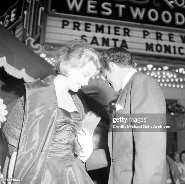 Actress Arlene Dahl and actor Fernando Lamas attends a premiere in Los Angeles, California.