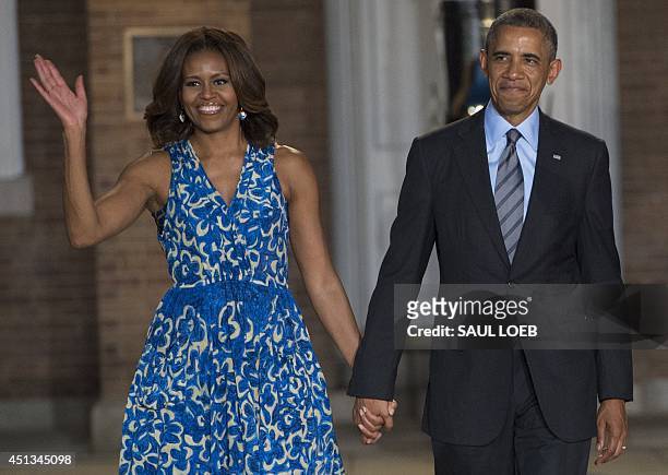 President Barack Obama and First Lady Michelle Obama attend the Marine Barracks Evening Parade at the Marine Barracks in Washington, DC, June 27,...