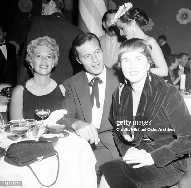 Actress Deanna Durbin with Dinah Shore and George Montgomery at dinner at Mocambo's in Los Angeles, California.