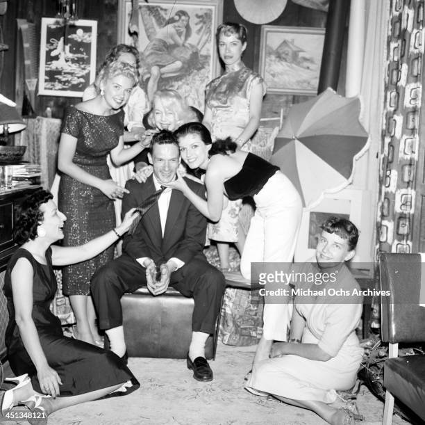 Hugh Hefner with Joan Bradshaw and girls at a Play Boy Party in Los Angeles, California.
