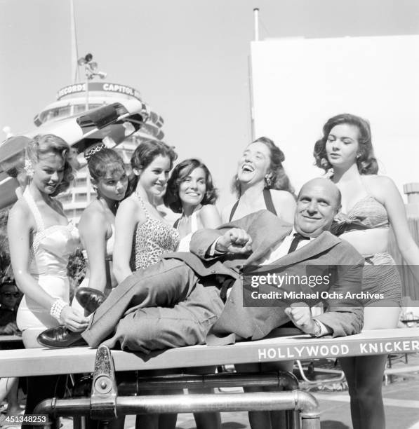 Actor Jackie Coogan poses with Patricia Deane, Patricia Craig, Jacqueline Sarrall, Kathi Thornton, Gloria Holliday, Joyce Andre in Los...