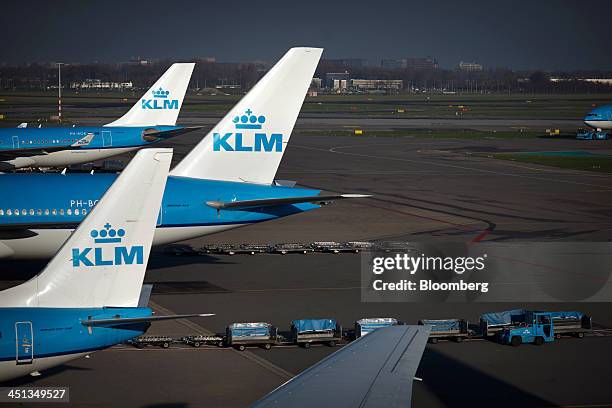 Logos sit on the tail fins of aircraft operated by Air France-KLM Group at Schiphol Airport, operated by the Schiphol Group, in Amsterdam,...