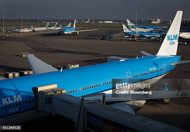 Passenger aircraft operated by Air France-KLM Group sit on the tarmac as jets operated by Transavia Airlines C.V. Stand parked beyond at Schiphol...