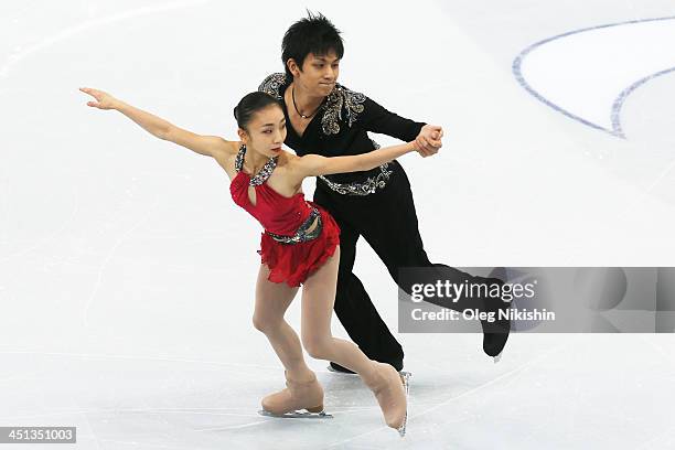 Narumi Takahashi and Ryuichi Kihara of Japan skates in the Pairs Short Program during ISU Rostelecom Cup of Figure Skating 2013 on November 22, 2013...