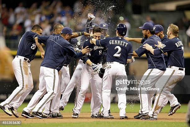 Ryan Braun of the Milwaukee Brewers celebrates after hitting a walk off single in the bottom of the ninth inning to put the brewers up 3-2 over the...