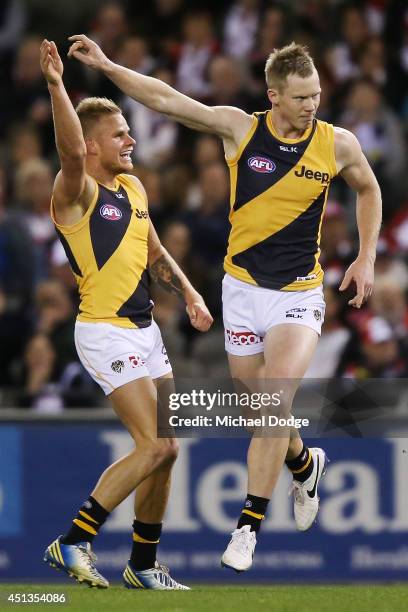 Jack Riewoldt of the Tigers celebrates a goal with Brandon Ellis during the round 15 AFL match between the St Kilda Saints and the Richmond Tigers at...