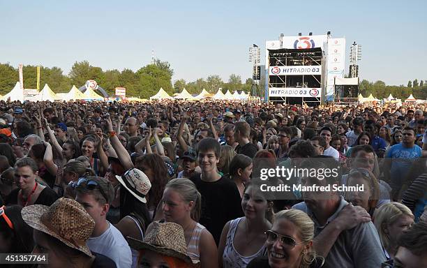 Festival-goers enjoy the atmosphere in the crowd at the Donauinselfest at Donauinsel on June 27, 2014 in Vienna, Austria. The Danube Island Festival,...