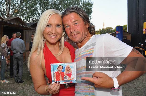 Marlena Martinelli and Frenkie Schinkels pose backstage for a photograph during the Donauinselfest at Donauinsel on June 27, 2014 in Vienna, Austria....