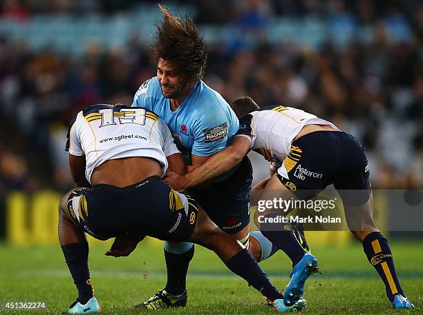 Tevoita Kuridrani of the Brumbies is knocked unconscious while attempting to tackle Jacques Potgieter of the Waratahs during the round 17 Super Rugby...