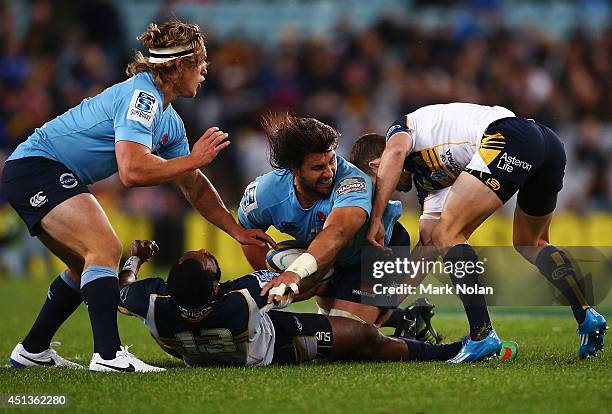 Tevoita Kuridrani of the Brumbies is knocked unconscious while attempting to tackle Jacques Potgieter of the Waratahs during the round 17 Super Rugby...