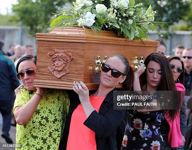 Family members carry the coffin of Gerry Conlon from his home in west Belfast on June 28, 2014. Conlon, who wrongly spent 15 years in jail over a...