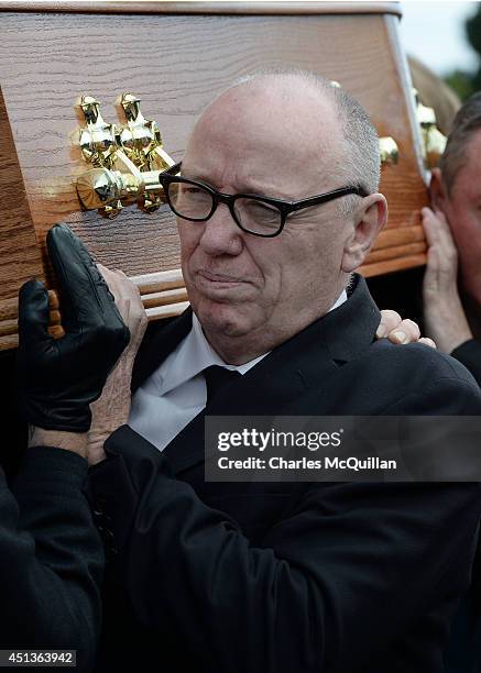 Northern Ireland film director and Oscar winner Terry George carries the coffin of Gerry Conlon from St. Peter's Cathedral after a requiem mass on...