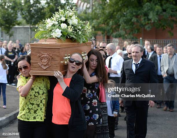 The coffin of Gerry Conlon is carried by family members into St. Peter's Cathedral for a requiem mass on June 28, 2014 in Belfast, Northern Ireland....