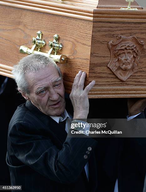 The coffin of Gerry Conlon is carried by Paddy Hill, a member of the so-called Birmingham Six, into St. Peter's Cathedral for a requiem mass on June...