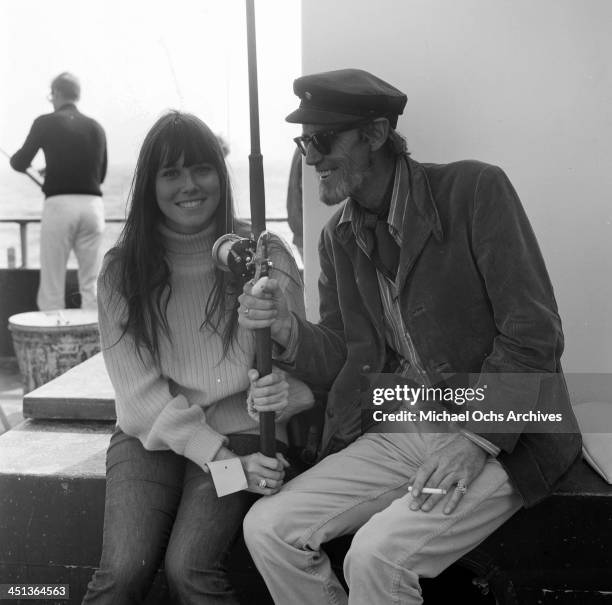 Actress Barbara Hershey sits with Earl Leaf at a pier in Los Angeles, California.