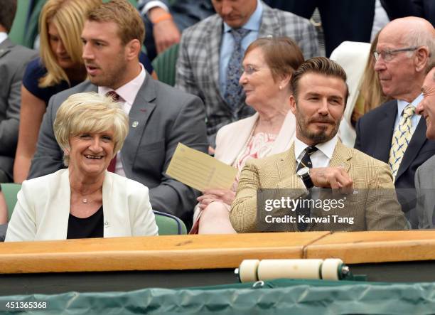 Sandra Beckham and David Beckham attend the Mikhail Kuskushkin v Rafael Nadal match on centre court during day six of the Wimbledon Championships at...