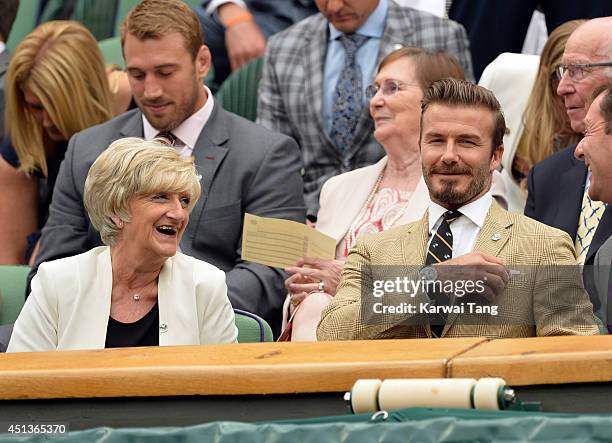 Sandra Beckham and David Beckham attend the Mikhail Kuskushkin v Rafael Nadal match on centre court during day six of the Wimbledon Championships at...