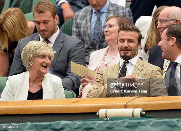 Sandra Beckham and David Beckham attend the Mikhail Kuskushkin v Rafael Nadal match on centre court during day six of the Wimbledon Championships at...