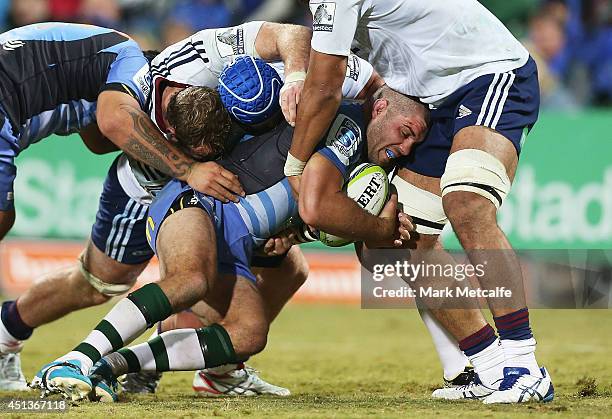 Matt Hodgson of the Force is tackled during the round 17 Super Rugby match between the Force and the Blues at nib Stadium on June 28, 2014 in Perth,...