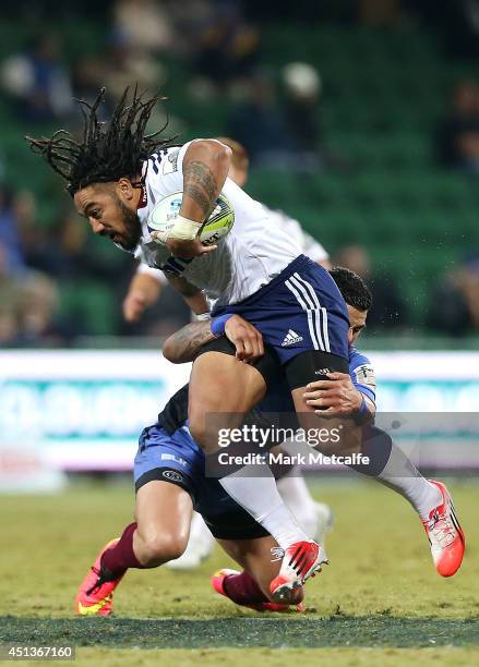 Ma'a Nonu of the Blues is tackled during the round 17 Super Rugby match between the Force and the Blues at nib Stadium on June 28, 2014 in Perth,...